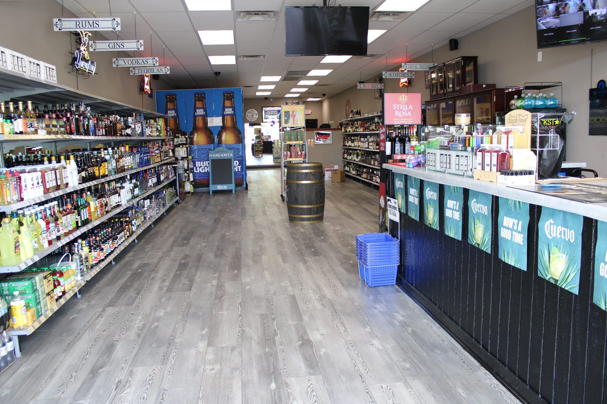 Inside the liquor store: stocked shelves, the counter, and the aisle the platform serves